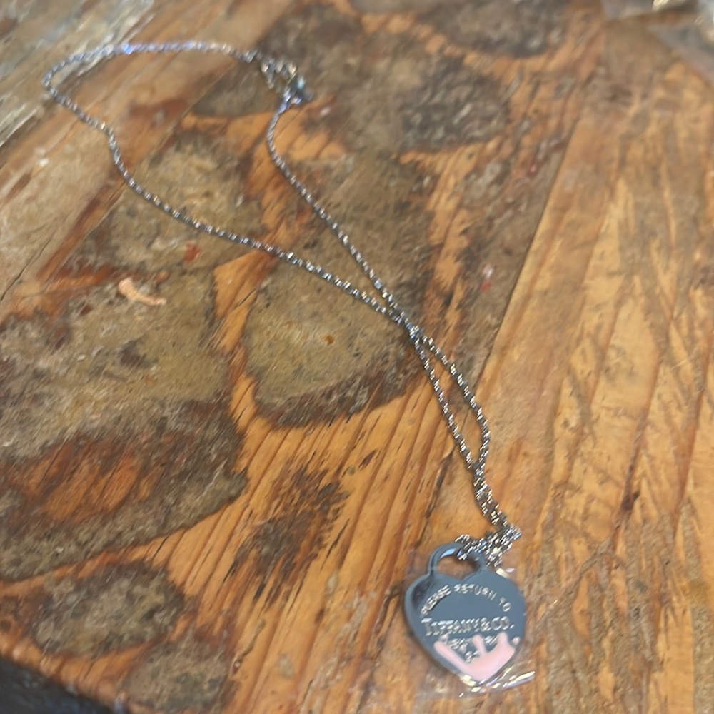 Silver heart necklace with a little pink. Stainless steel.